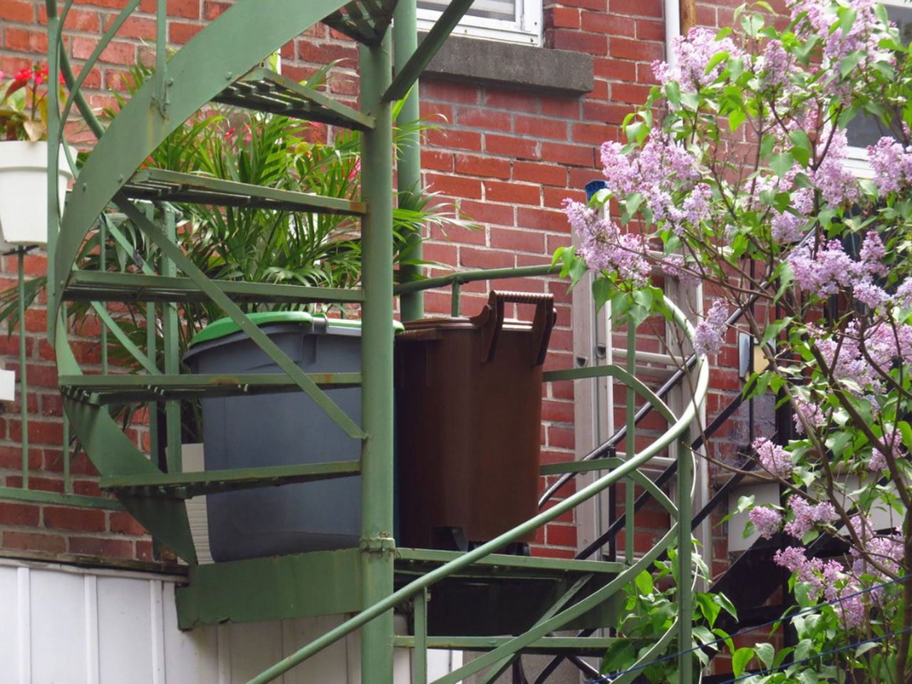 Compost Bins On Green Metal Stairs