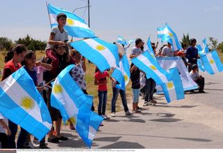 Argentinian flags dotted along the roadside