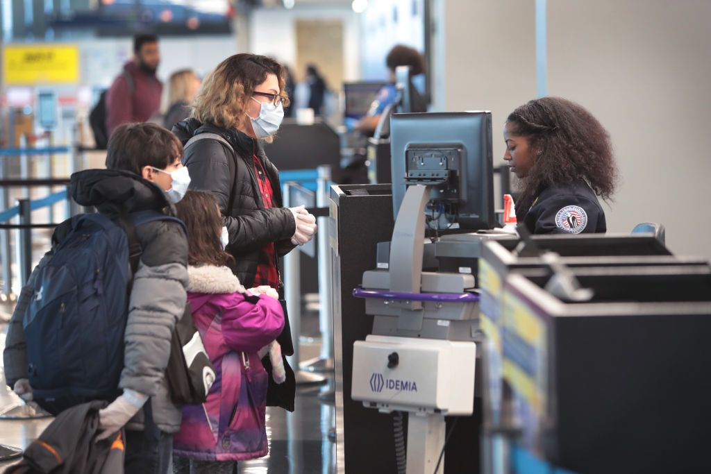 Passenger go through TSA screening at a nearly-deserted O&amp;#039;Hare International Airport on April 2, 2020 in Chicago, Illinois