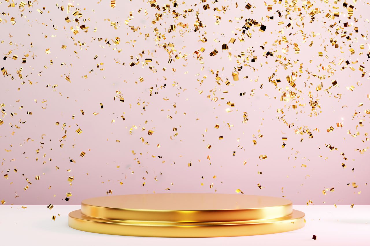 Two-tier round gold metal podium on pastel pink background with many falling gold confetti. Perfect platform for showing your products. 