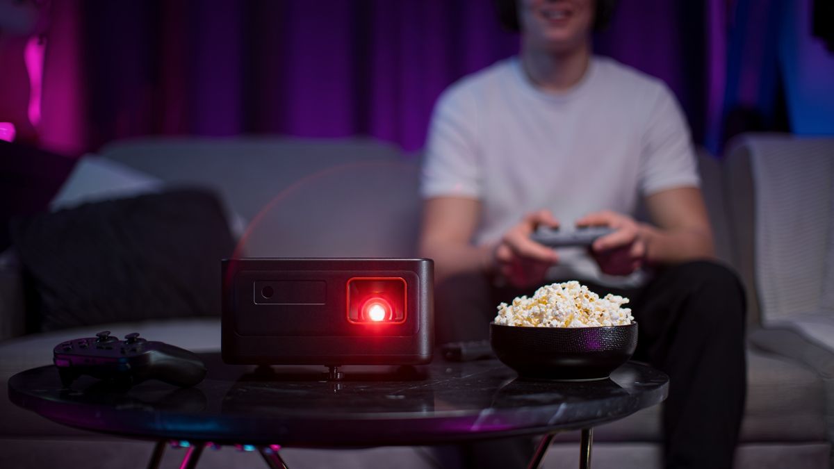 Philips Game Pix 900 gaming projector in a living room