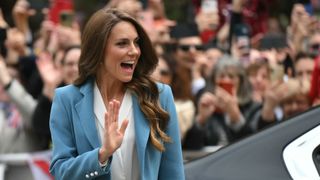 Britain's Catherine, Princess of Wales waves as she arrives at Reggio Emilia town hall during a two-day visit in Italy, on May 13, 2026. (Photo by Marco BERTORELLO / POOL / AFP)