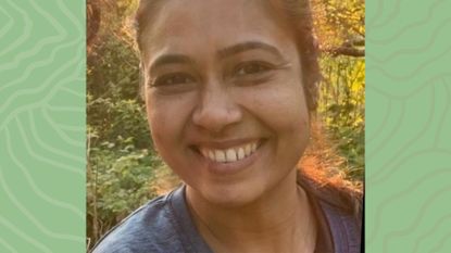 Renu Amin smiling at the camera