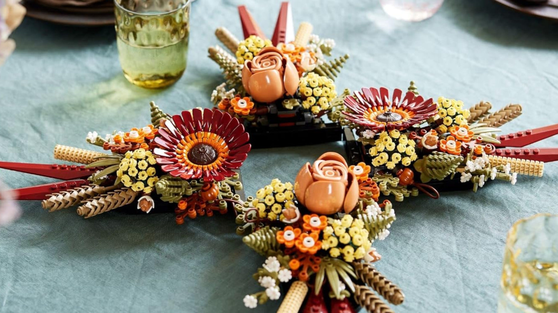 Lego Dried Flower Centerpiece on a table, beside glasses filled with water