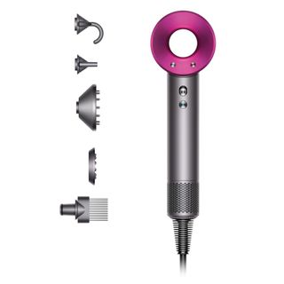dyson supersonic hairdryer with all the head attachments in iron and fuchsia