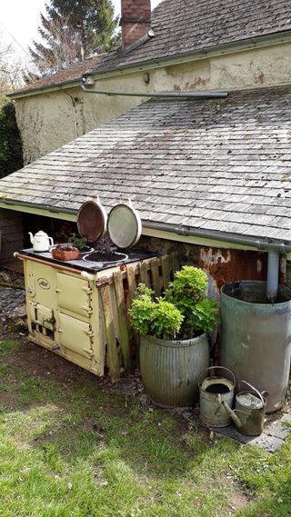 An old aga used as an alternative planter in a country garden