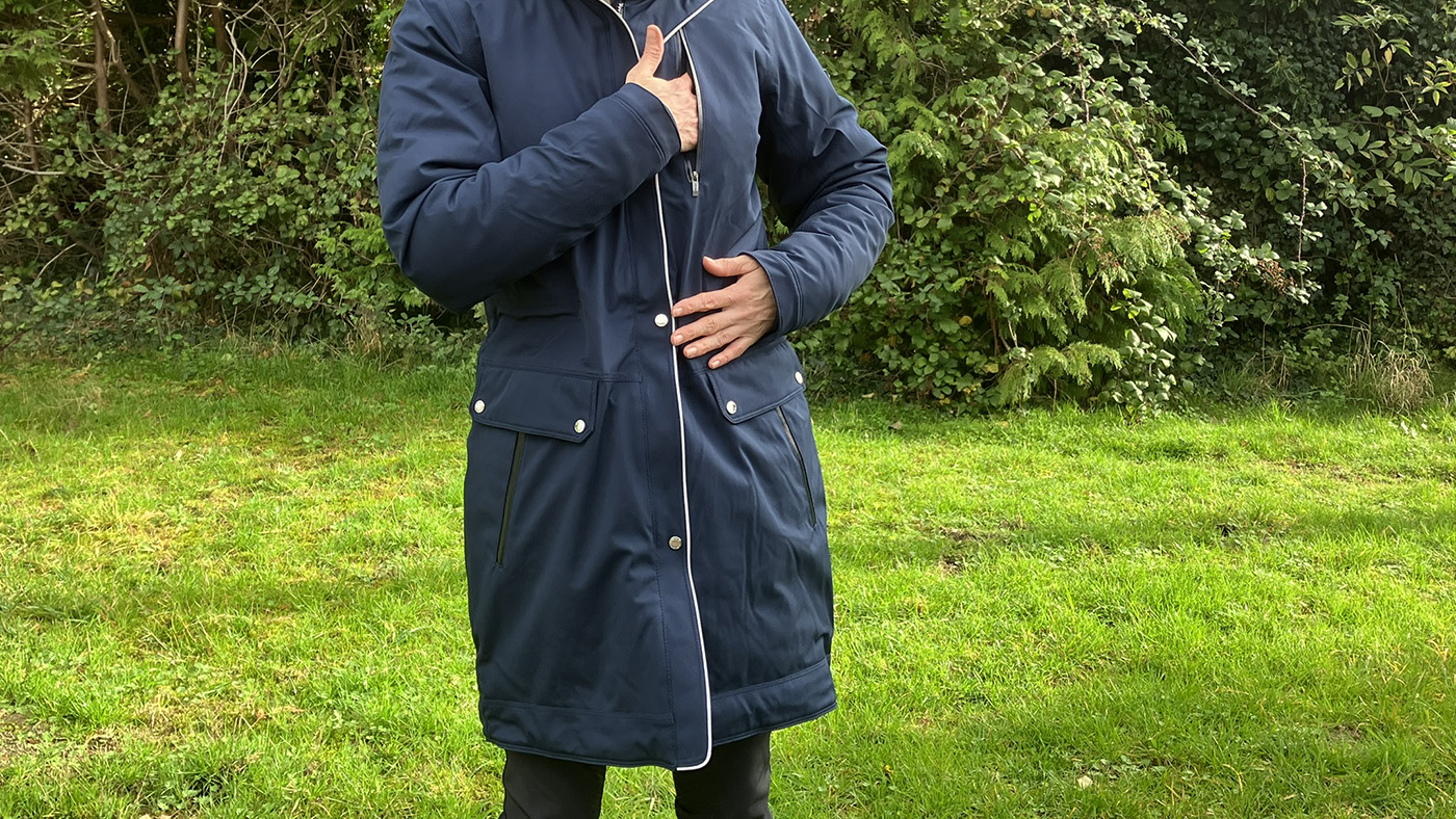 Showing the pockets on the Ariat Tempest Waterproof Insulated Parka