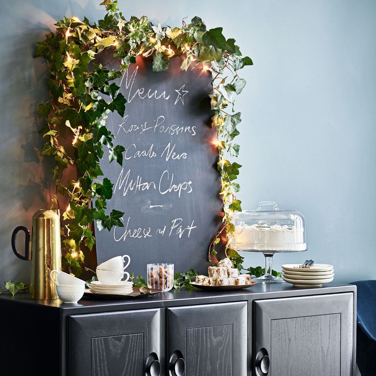 Navy room with chalk board and black console