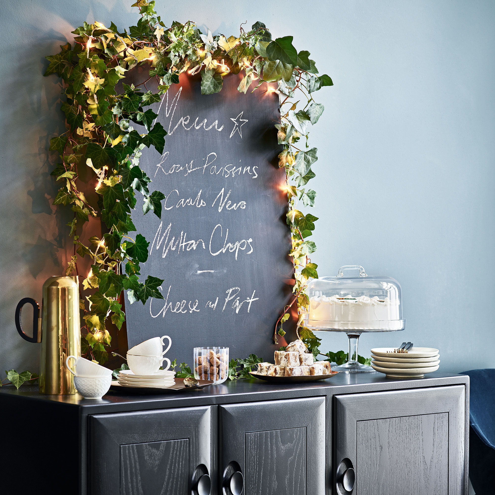 Navy room with chalk board and black console