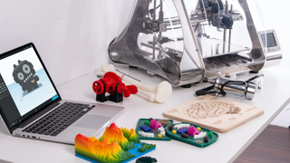 3D modeling software being used on a laptop to make colorful 3D printing assets