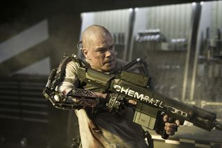 Matt Damon Brandishes Weapon in 'Elysium'
