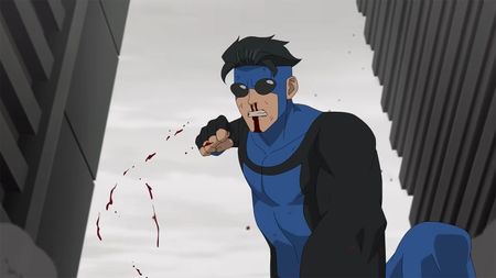 An angry Mark punching someone on the ground as blood flies off his right fist in Invincible season 4