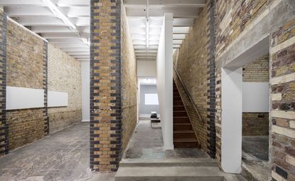 Interior with brick wall and stair of Matheson Whiteley