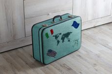 suitcase with different flags