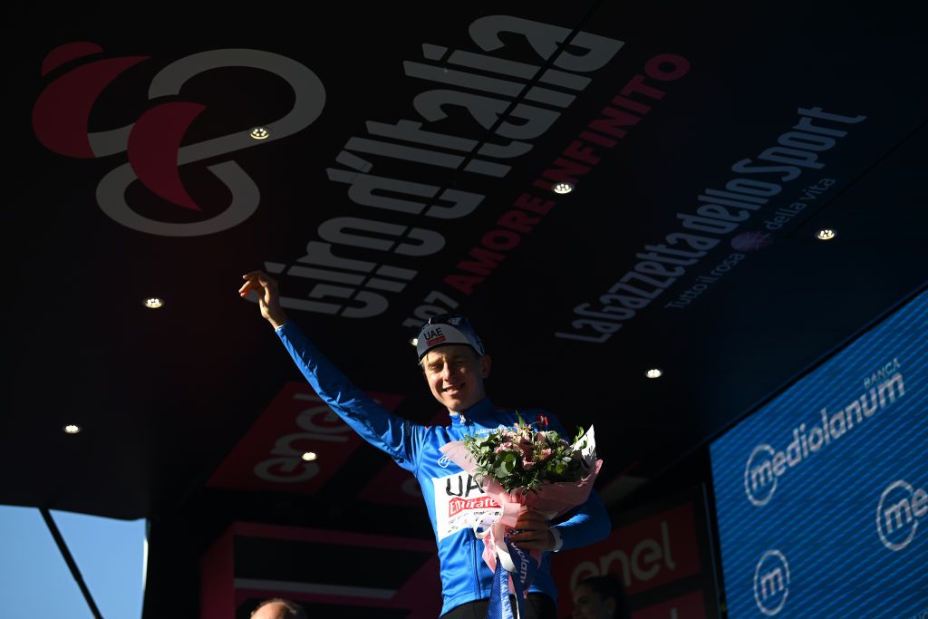 LUCCA ITALY MAY 08 Tadej Pogacar of Slovenia and UAE Team Emirates celebrates at podium as Blue Mountain Jersey winner during the 107th Giro dItalia 2024 Stage 5 a 178km stage from Genova to Lucca UCIWT on May 08 2024 in Lucca Italy Photo by Dario BelingheriGetty Images