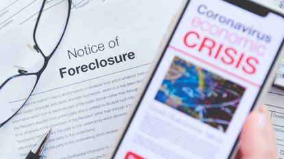 Phone with coronavirus crisis news headline over a foreclosure notice