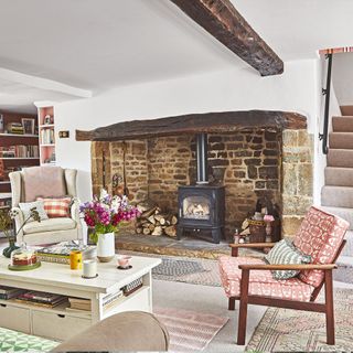 living room with inglenook fireplace and cosy armchairs future
