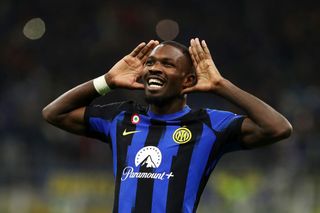 Marcus Thuram of FC Internazionale celebrates after scoring the team's first goal during the Serie A TIM match between FC Internazionale and AS Roma at Stadio Giuseppe Meazza on October 29, 2023 in Milan, Italy.