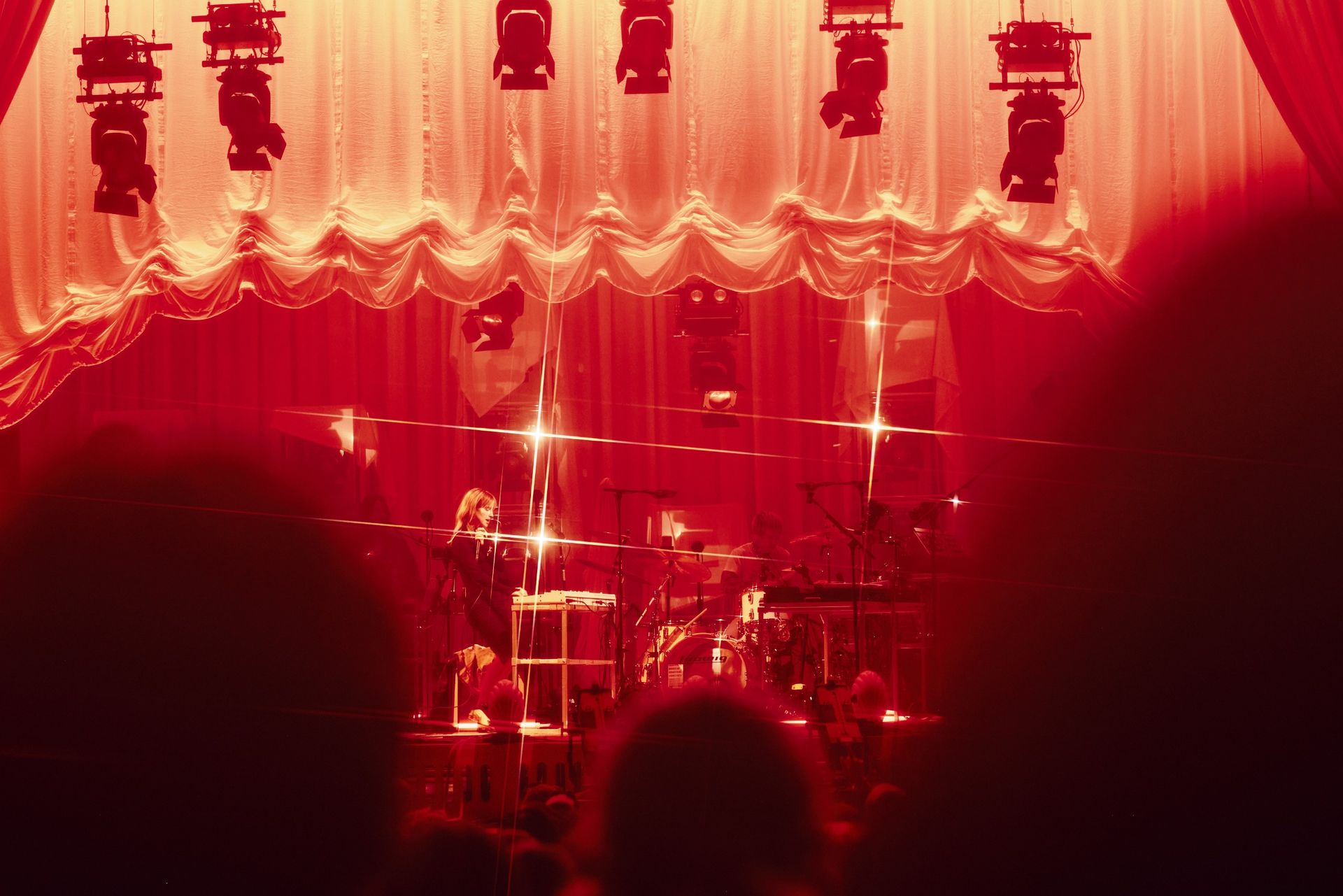 bands on stage in pink light