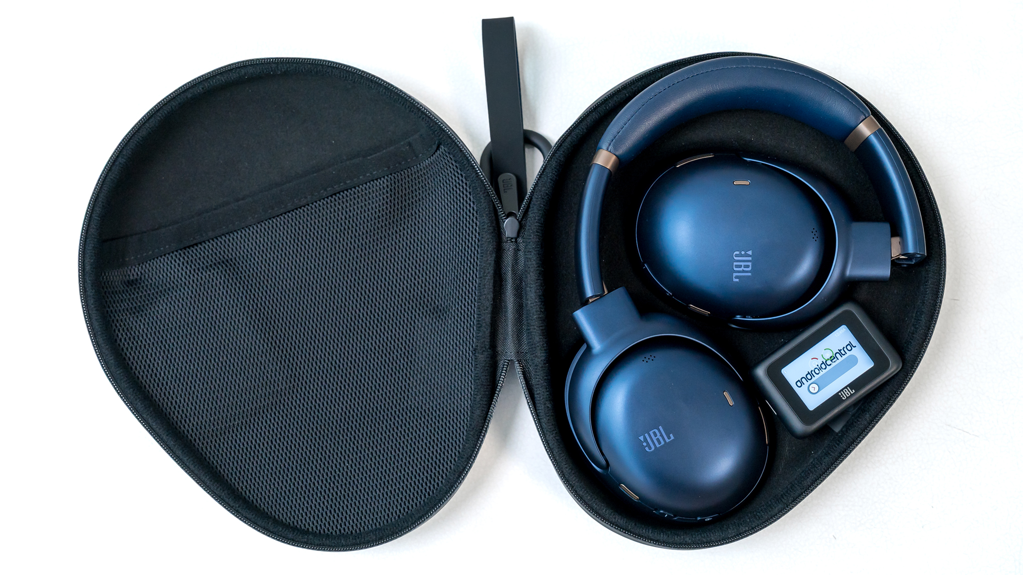 JBL Tour One M3 headphones folded in carrying case.