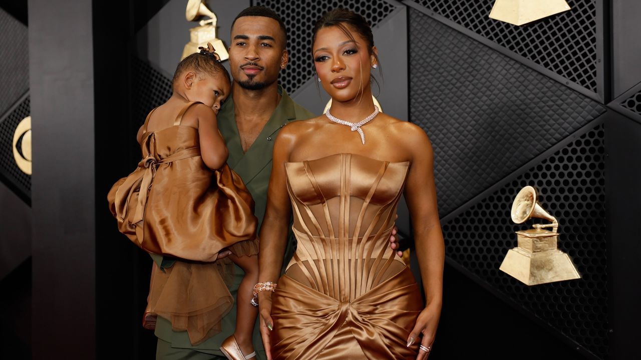 John Gaines, Victoria Monét and Hazel Monét arrives on the Red Carpet for the 66th Grammy Awards