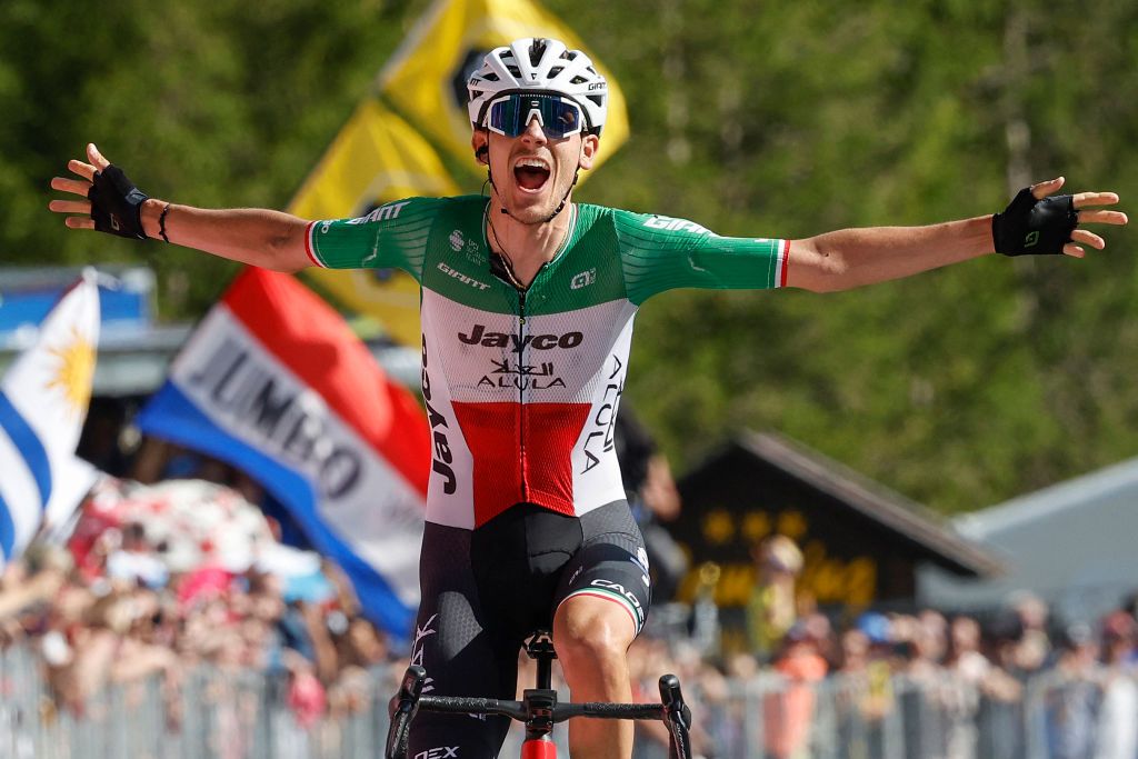 Team Jayco AlUlas Filippo Zana rider Filippo Zana celebrates on the finish line as he wins the eighteenth stage of the Giro dItalia 2023 cycling race 161 km between Oderzo and Val di Zoldo on May 25 2023 Photo by Luca BETTINI AFP Photo by LUCA BETTINIAFP via Getty Images