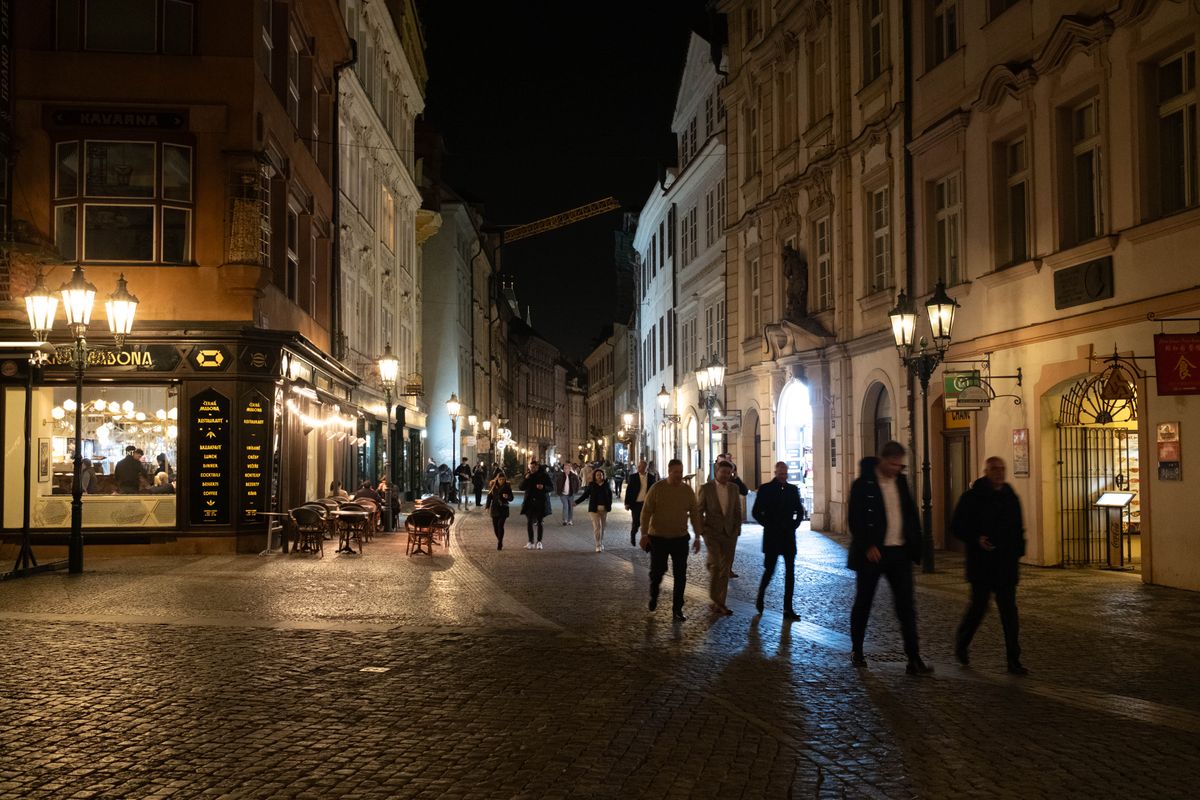 A street in Prague lit up at night