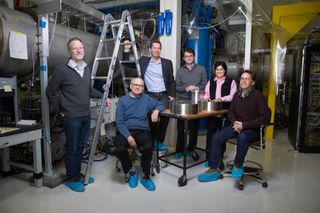 Rainer Weiss (center, seated) poses with members of the MIT LIGO team. Weiss was honored along with Caltech's Barry Barish and Kip Thorne with the 2017 Nobel Prize in physics for detecting gravitational waves.