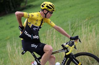 Chris Froome carrying a musette