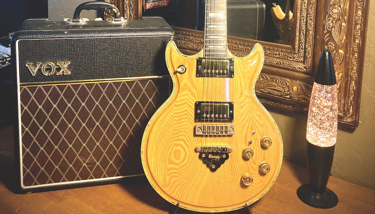 An Ibanez Artist Model 2617 guitar, stood next to a Vox amplifier