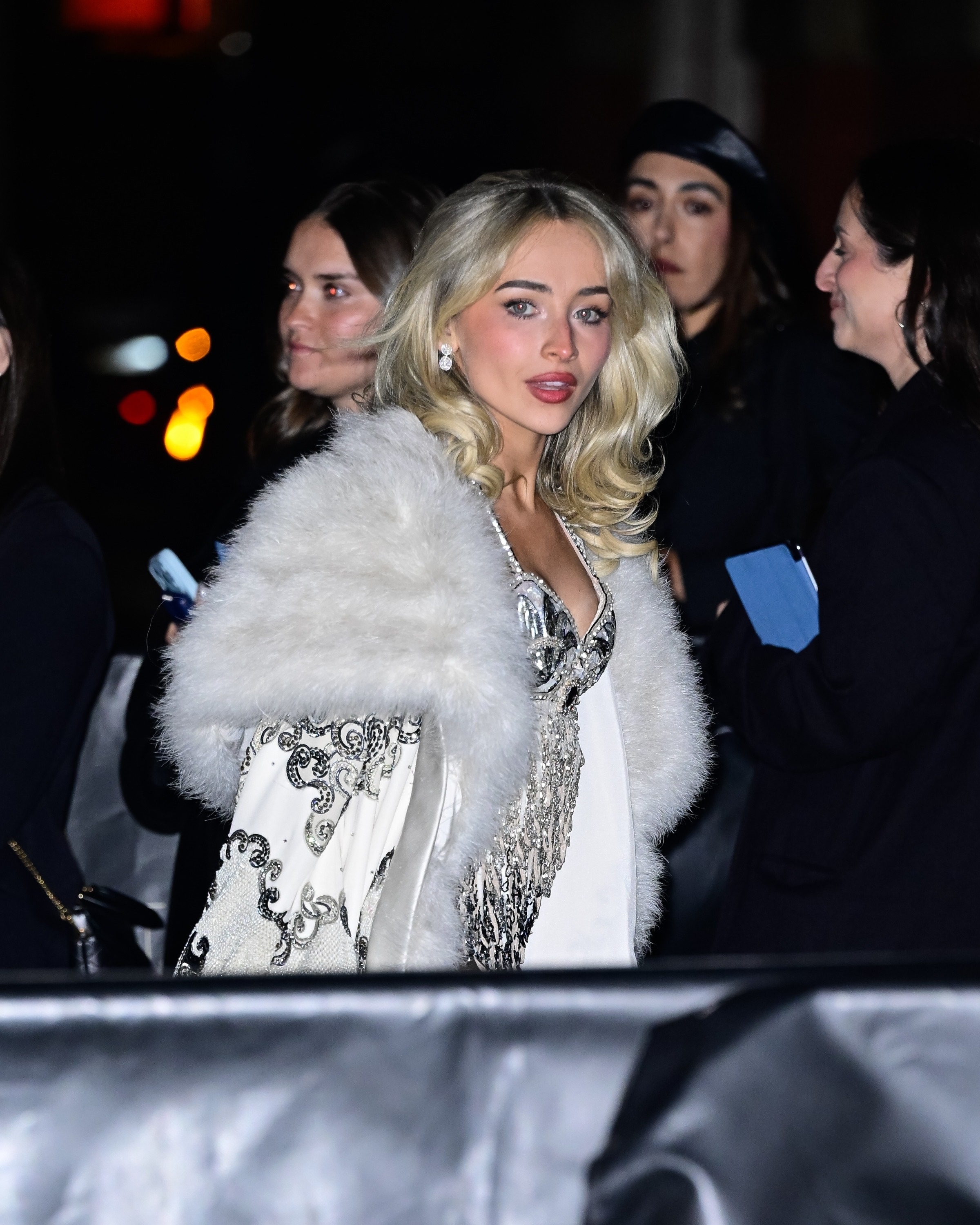 a paparazzi photo of sabrina carpenter at a met gala after-party