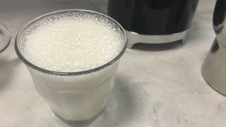 smeg milk frother milk with bubbles on top