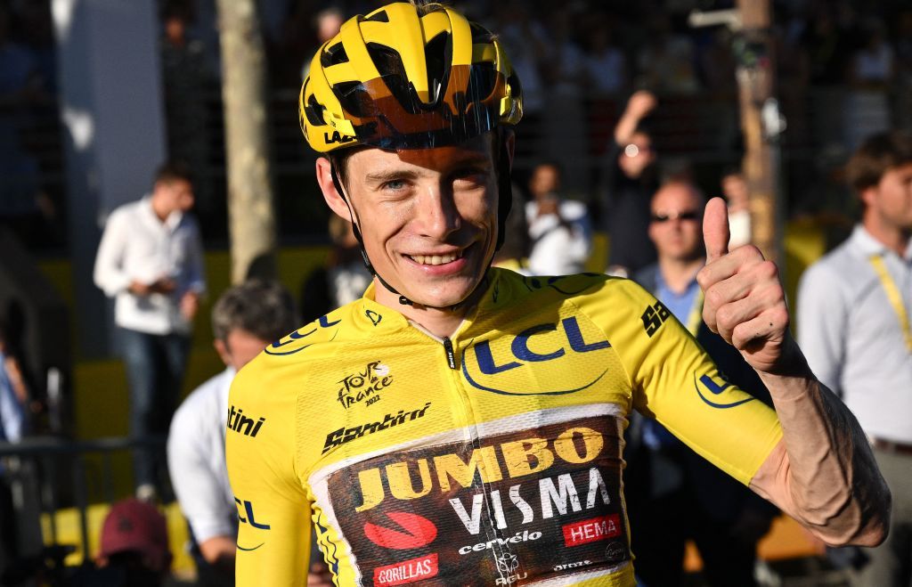 JumboVisma teams Danish rider Jonas Vingegaard wearing the overall leaders yellow jersey gives a thumbs up as he celebrates winning the 109th edition of the Tour de France cycling race after the 21st and final stage 1156 km between La Defense Arena in Nanterre outside Paris and the ChampsElysees in Paris France on July 24 2022 Photo by Marco BERTORELLO AFP Photo by MARCO BERTORELLOAFP via Getty Images