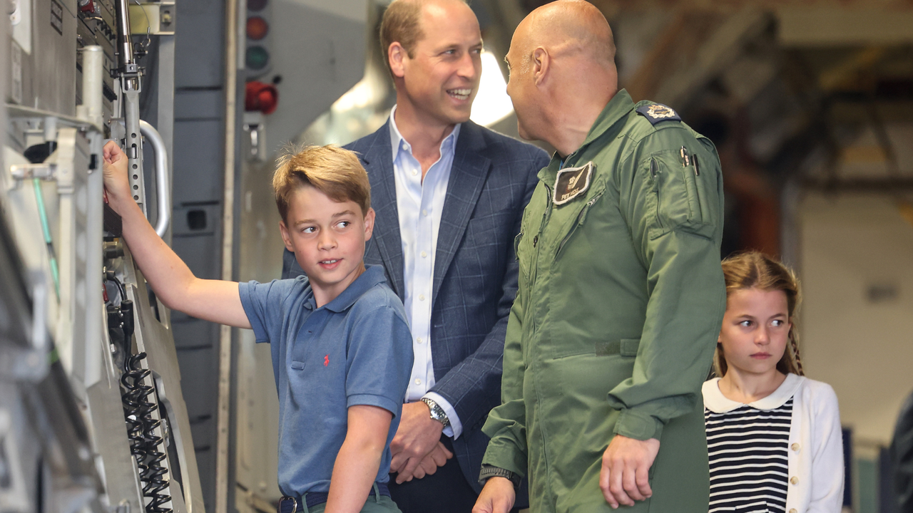 Prince William, Prince of Wales with Prince George of Wales and Princess Charlotte of Wales during their visit to the Air Tattoo at RAF Fairford on July 14, 2023 in Fairford, England. 