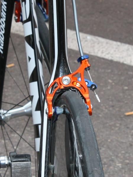 Many team bikes have their rear brakes conventionally mounted on the back of the seat stays but production bikes will see them moved to below and behind the bottom bracket.