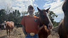 Adam Watson standing with a horse