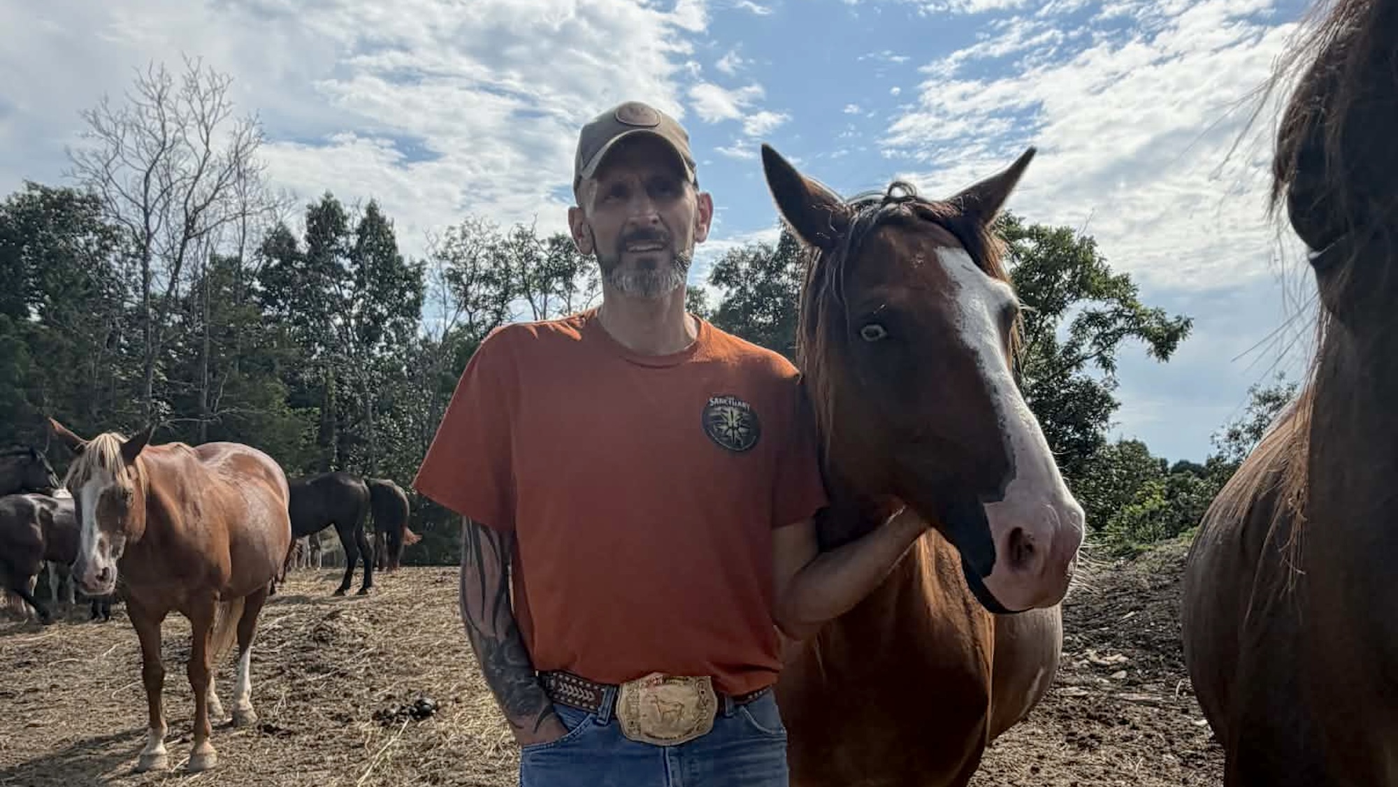 Adam Watson standing with a horse