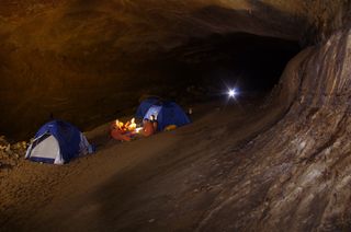 Five astronauts that took part in the European Space Agency's CAVES 2011 mission gather at their campsite for daily debriefings.