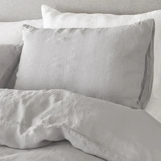 White linen bedding on a bed