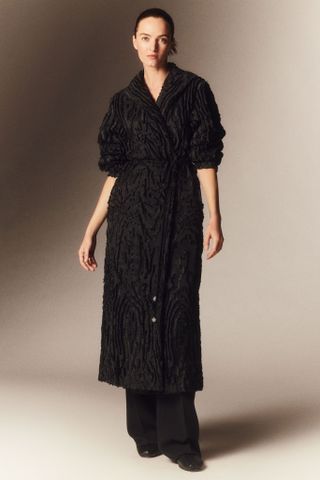 model wearing a black coat by Lafayette 148 New York
