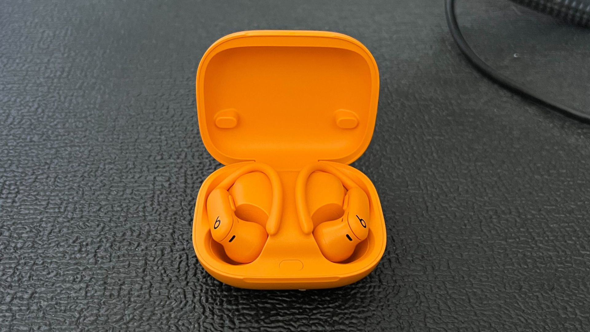 Beats headphones sitting on black mat