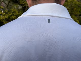 Horns logo on the back of the polo shirt