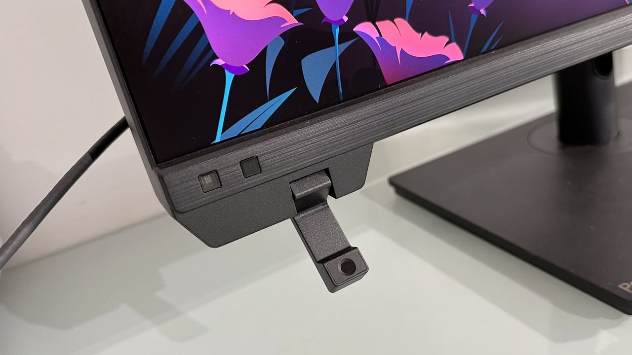 The Asus ProArt PA32KCX 8K monitor on a white desk in a home office during our review process