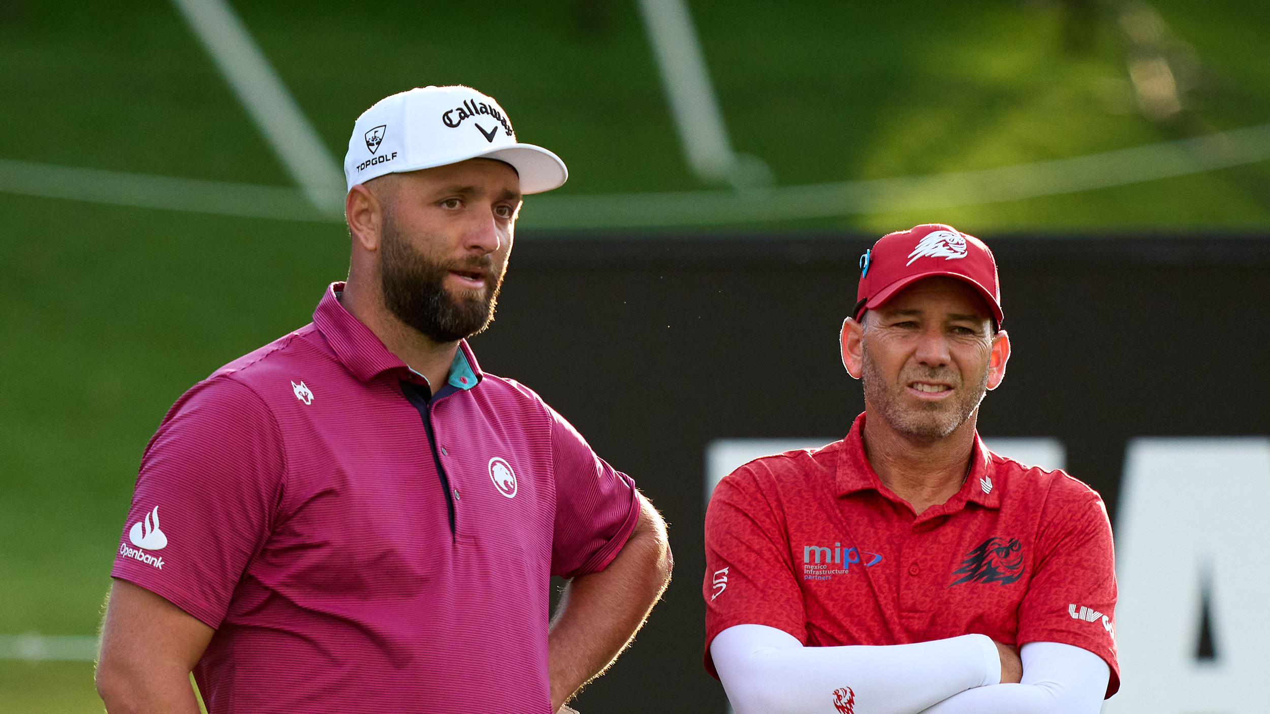 Jon Rahm (left) and Sergio Garcia talk during LIV Golf Andalucia 2025