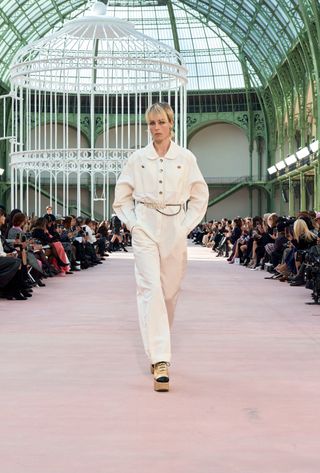 A model walking in the spring summer 2025 Chanel show at the Grand Palais during Paris Fashion Week.