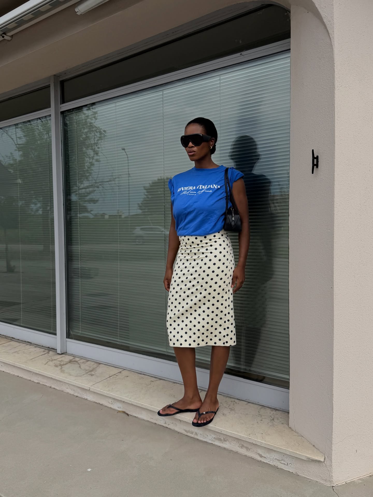 Marilyn wearing polka dot skirt and blue t shirt