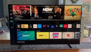Samsung Q60B on a table, showing the smart TV interface