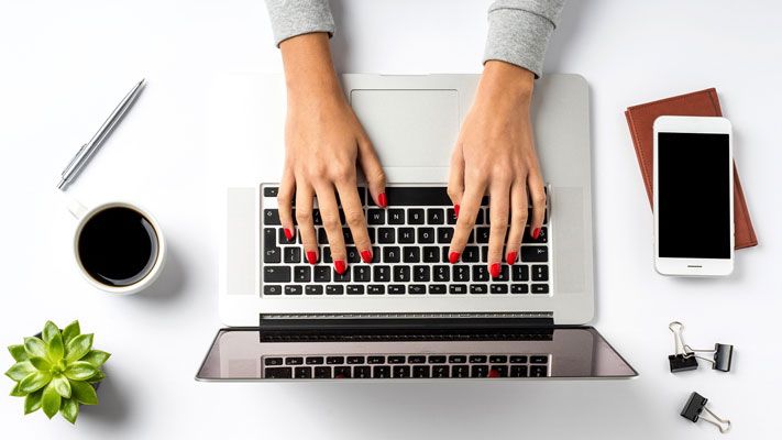 woman typing on keyboard