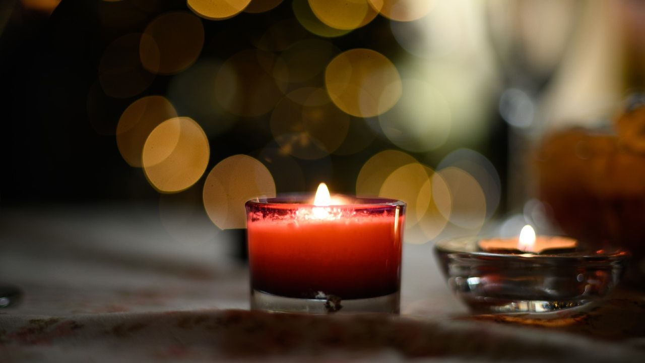 Close-Up Of Lit Tea Light Candles - stock photo