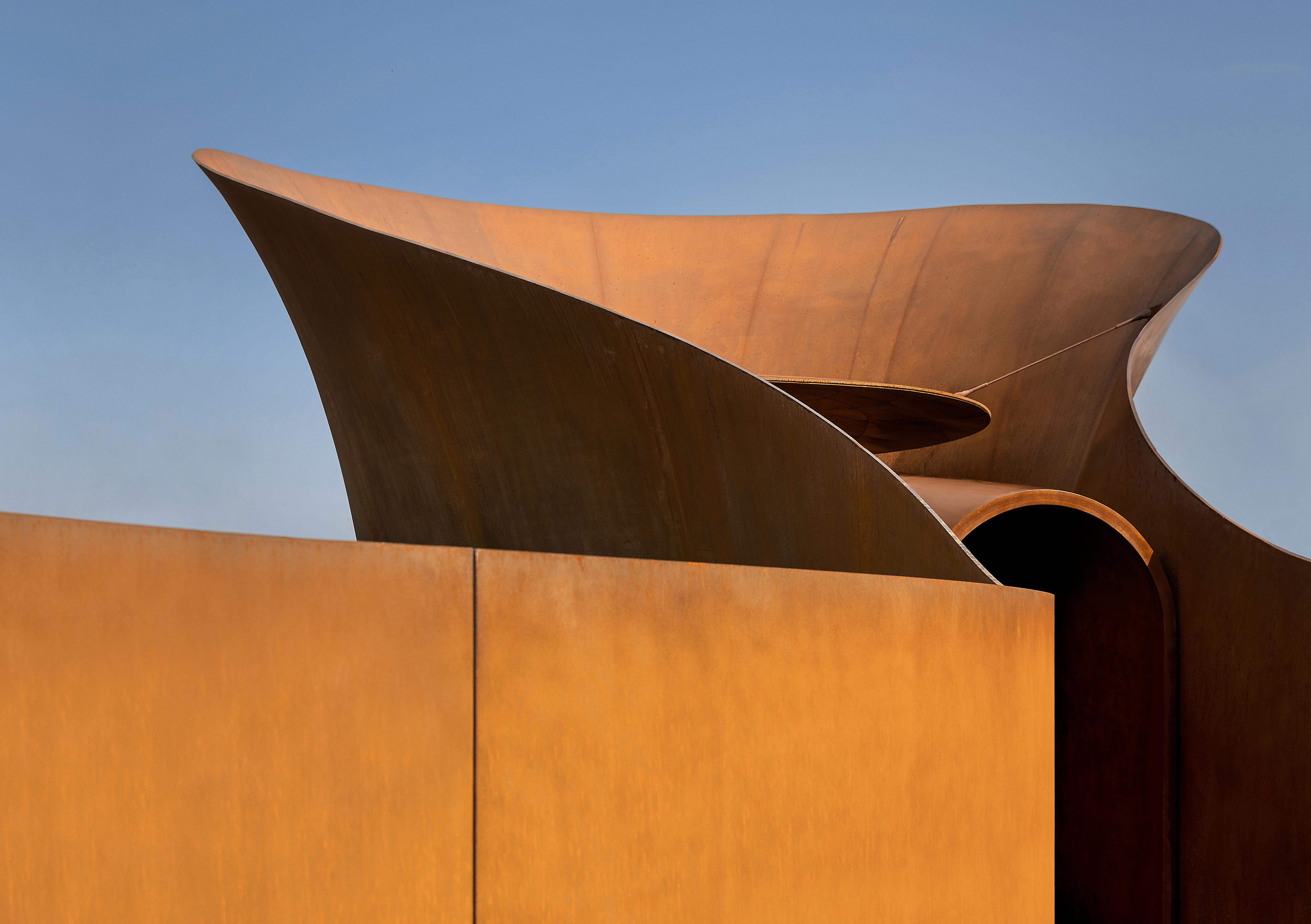 Doshi Retreat at Vitra, the pavilion's curved forms in brown corten steel cladding